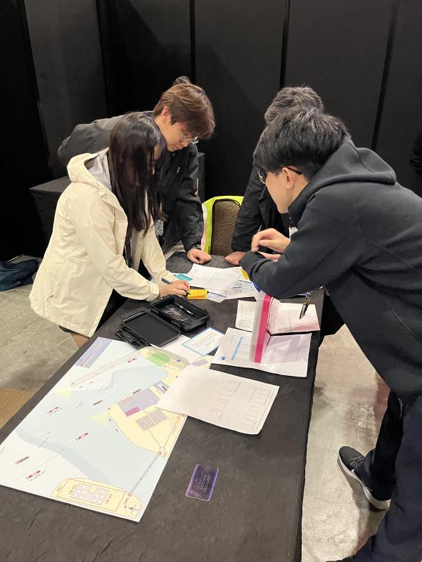 Participants working through the SherpaSec cybersecurity escape room